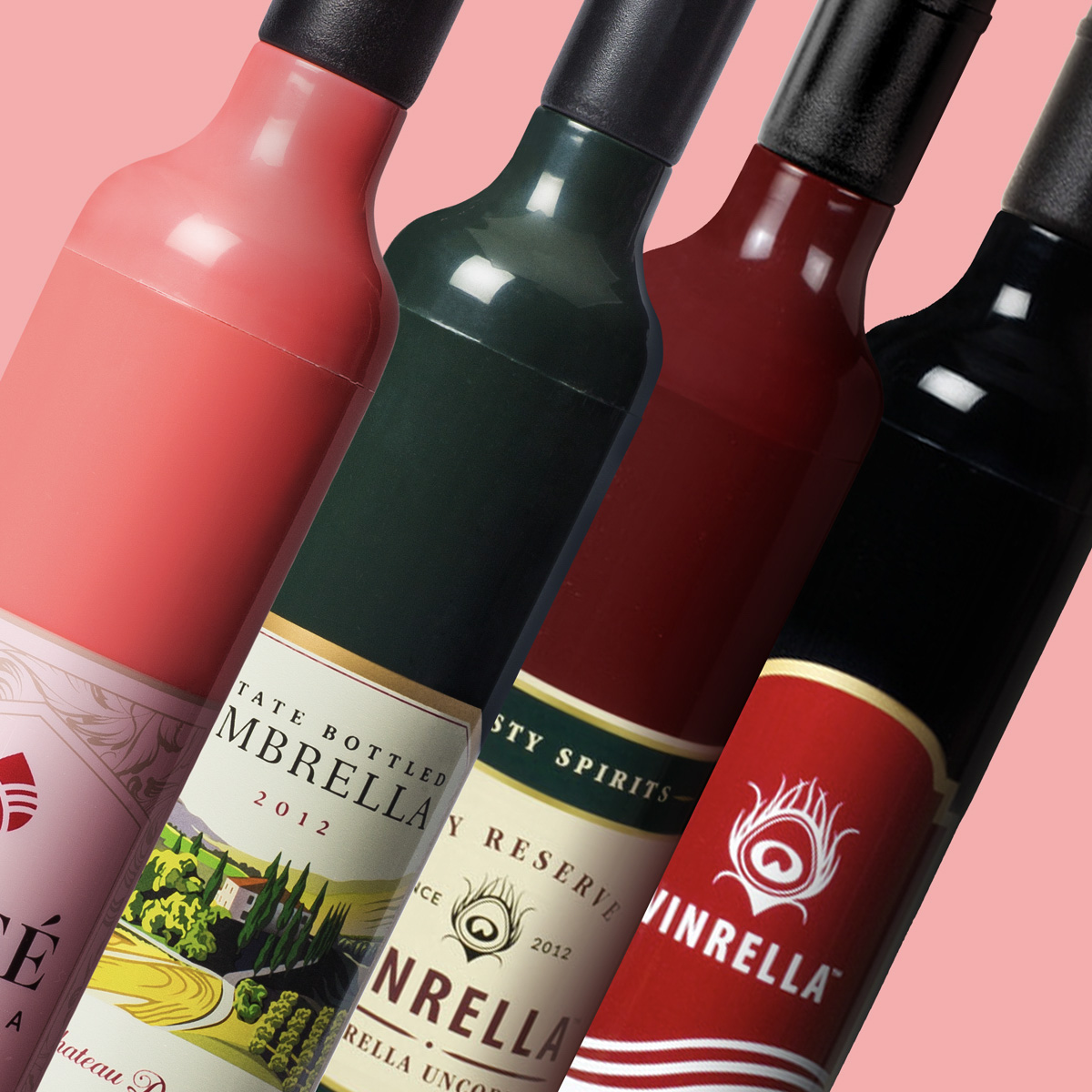 Close-up of four wine bottles with labels showing Vinrella brand on a pink background.