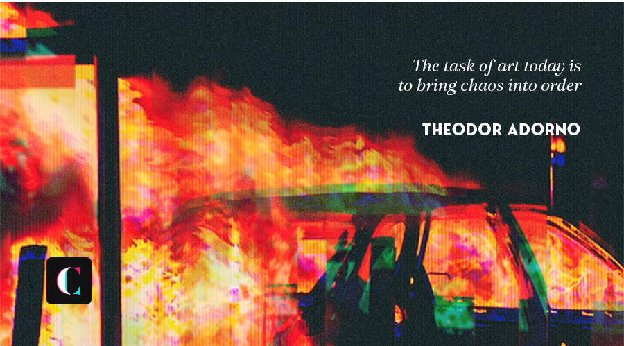 A car engulfed in bright flames at night with the quote 'The task of art today is to bring chaos into order' by Theodor Adorno in white text on a dark background.