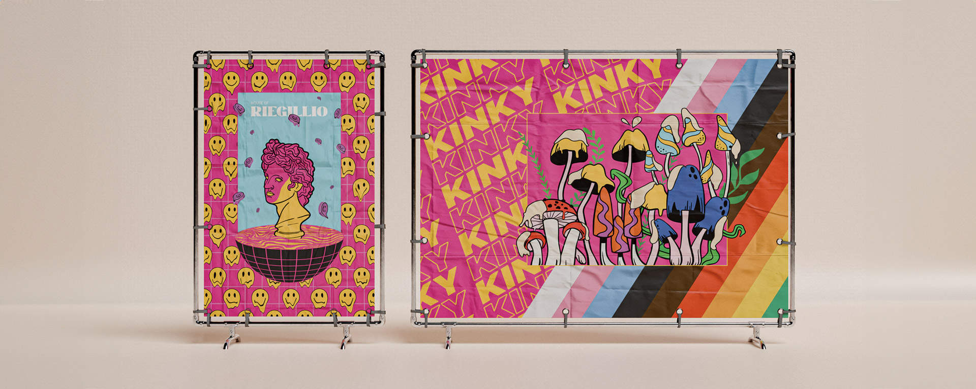 Two colorful fabric banners on metal stands featuring pop art designs: one with yellow smiley faces and a pink statue bust, the other with stylized mushrooms and bold text 'KINKY'.